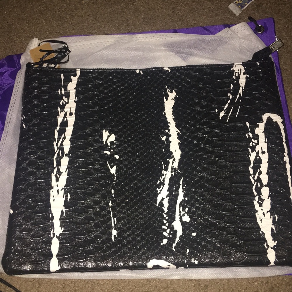 Brand new Black & White faux reptile wristlet